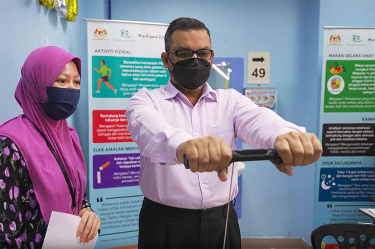 Patient getting his Body Mass Index measurements at the health facility.